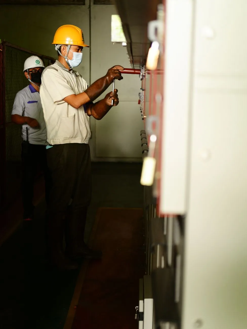 electrician working electrical panel