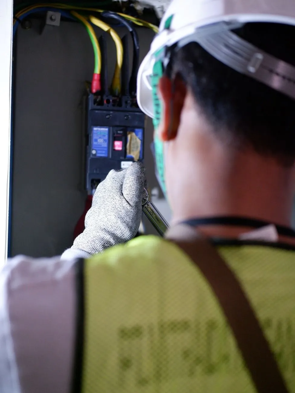 electrician working electrical panel