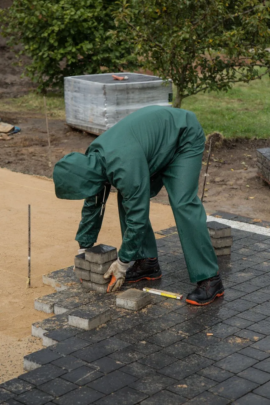 tile installer laying ceramic floor