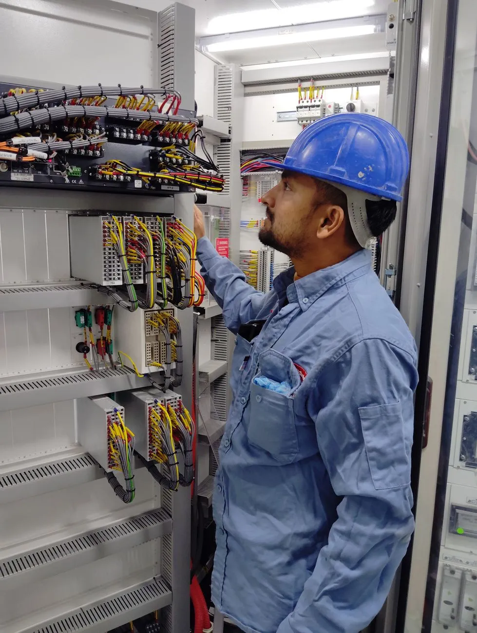 electrician working electrical panel